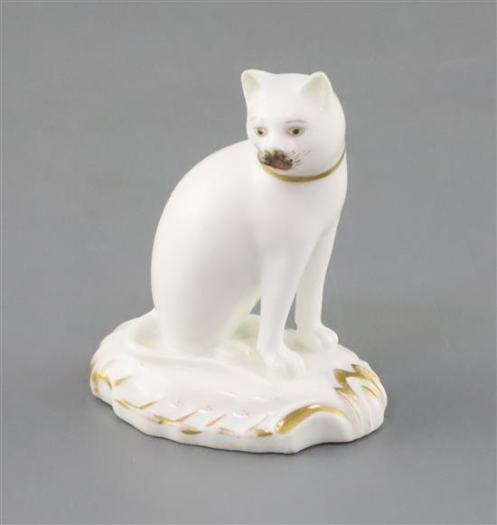 A rare Rockingham porcelain figure of a seated cat, c.1830, H. 5.5cm